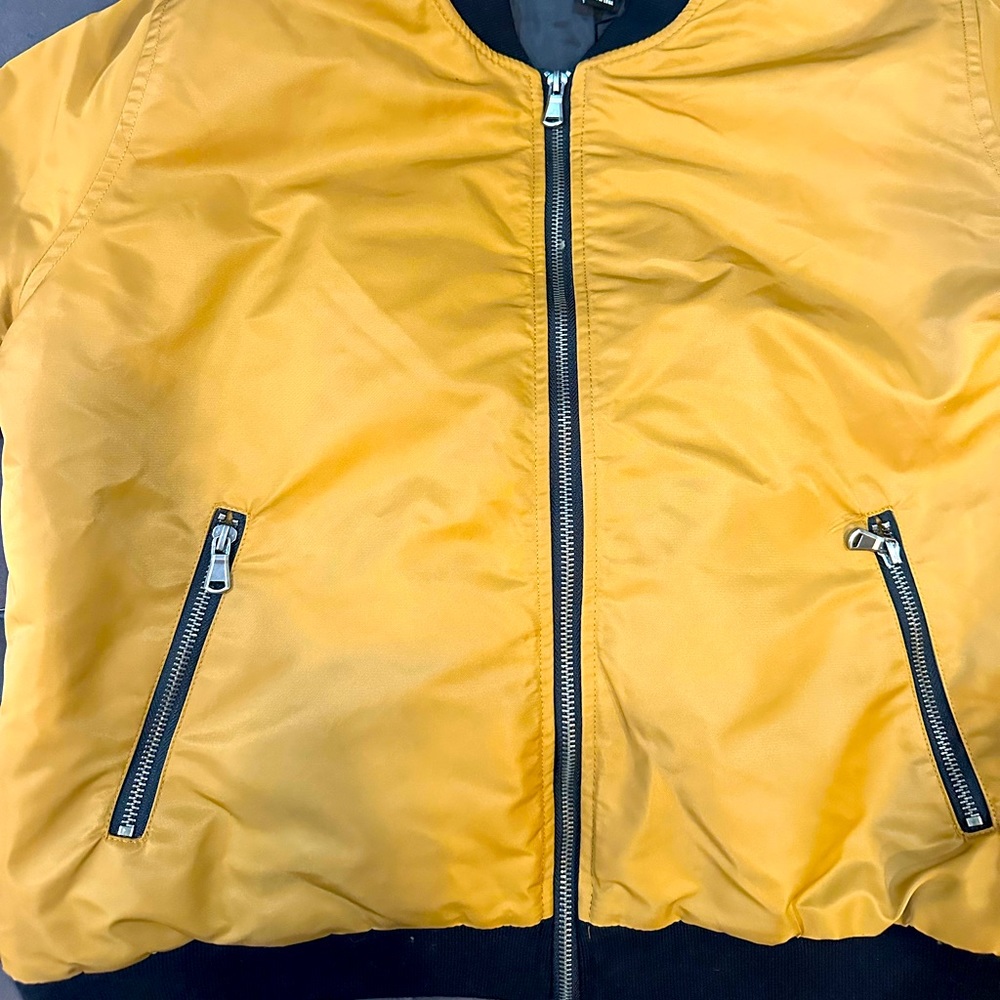 Forever 21 bomber jacket. Light weight and durable. Dark khaki/ goldish color.